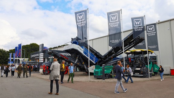 The Wirtgen Group booth at Nordbau 2025 showed a wide range of machines and exhibits