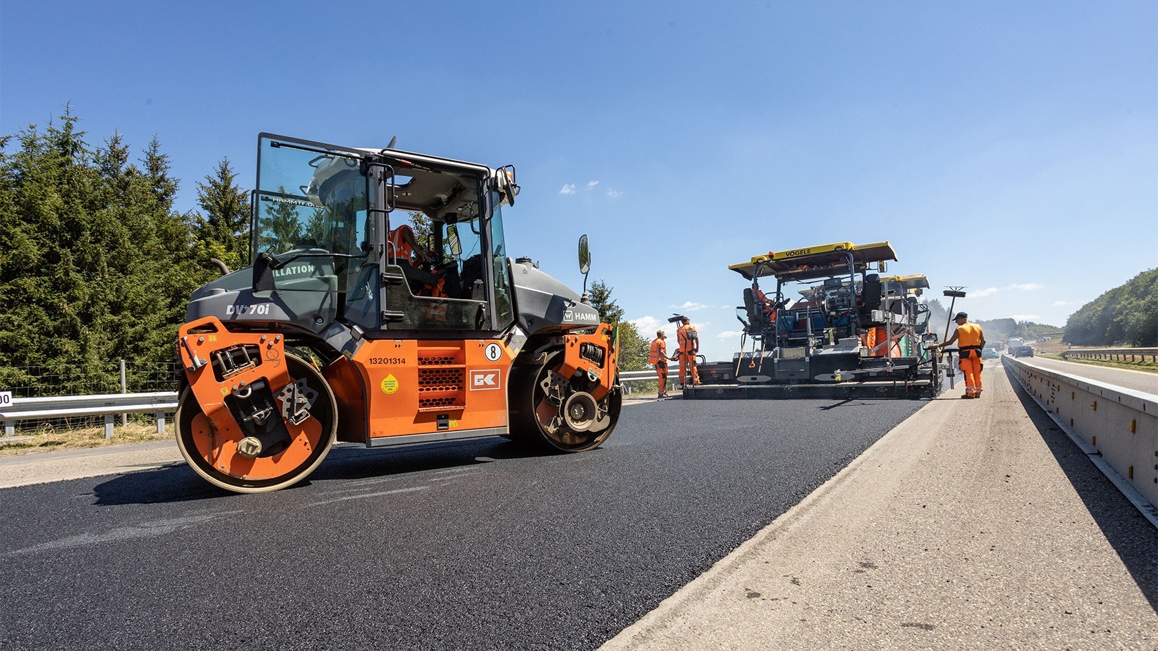 Hamm roller and Vögele paver during asphalt paving