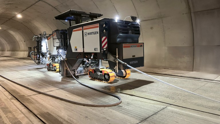 Large milling machine W 210 XF in a tunnel; lit by floodlights