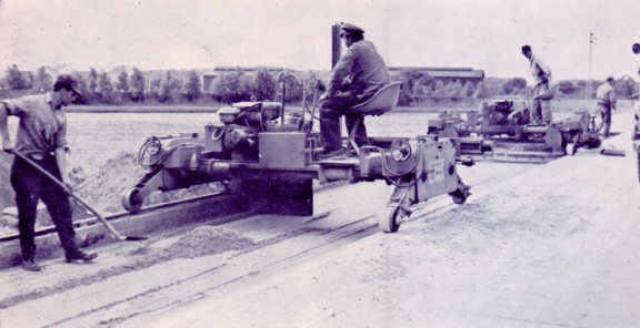 Image shows the hard shoulder of a motorway being paved.