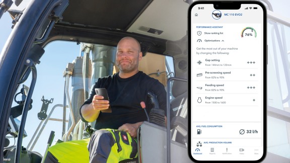 Operator in the feeding device with smartphone in his hand; smartphone with screenshot