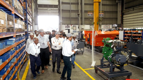 Participants taking part in a factory tour