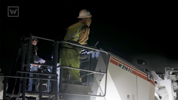 Close-up of the operator’s platform with two operators monitoring the milling process
