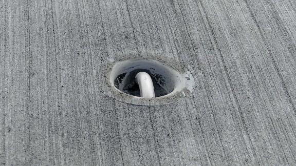 After curing, safe and secure lashing of equipment on the apron and pad areas is guaranteed by tie-downs embedded in the concrete.