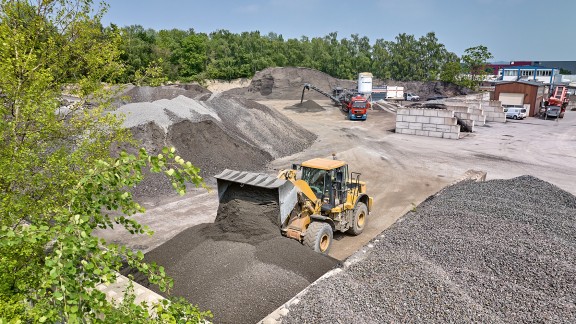 The cold mix is stockpiled at the contractor’s depot.