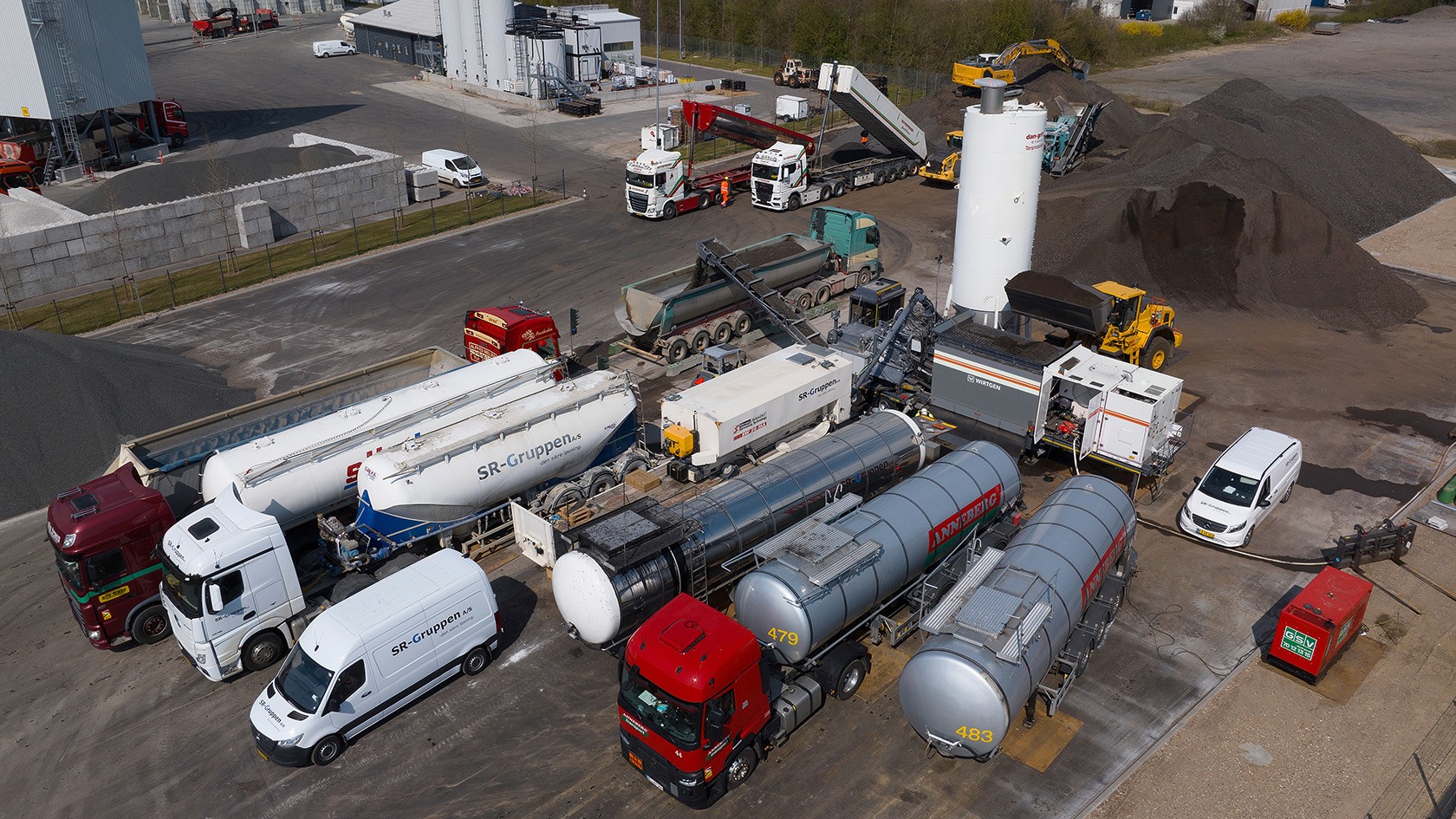 Birds-eye view of a cold mixing plant and a machine fleet at SR-Gruppen A/S.