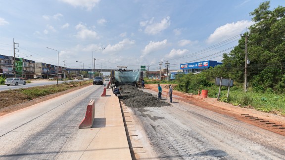 The Surat Thani project site; the SP 64 in the distance; work in progress on the right-hand lane.