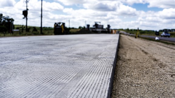 Road surface with grooves