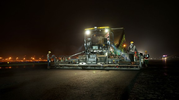 Rear right view of a paver at night.