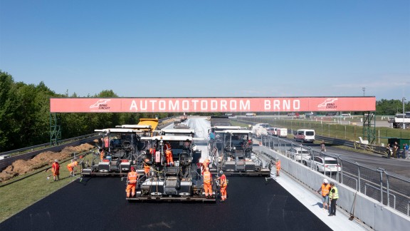 Vögele Pavers paving asphalt on a race track.