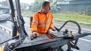 Portrait of a paver driver, including operator console