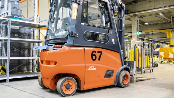 Electric forklift truck in the warehouse