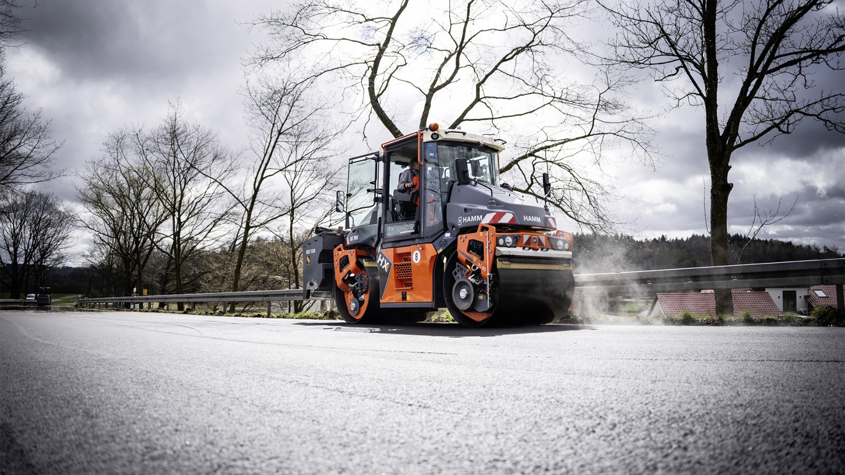 Hamm roller compacting, asphalt steaming