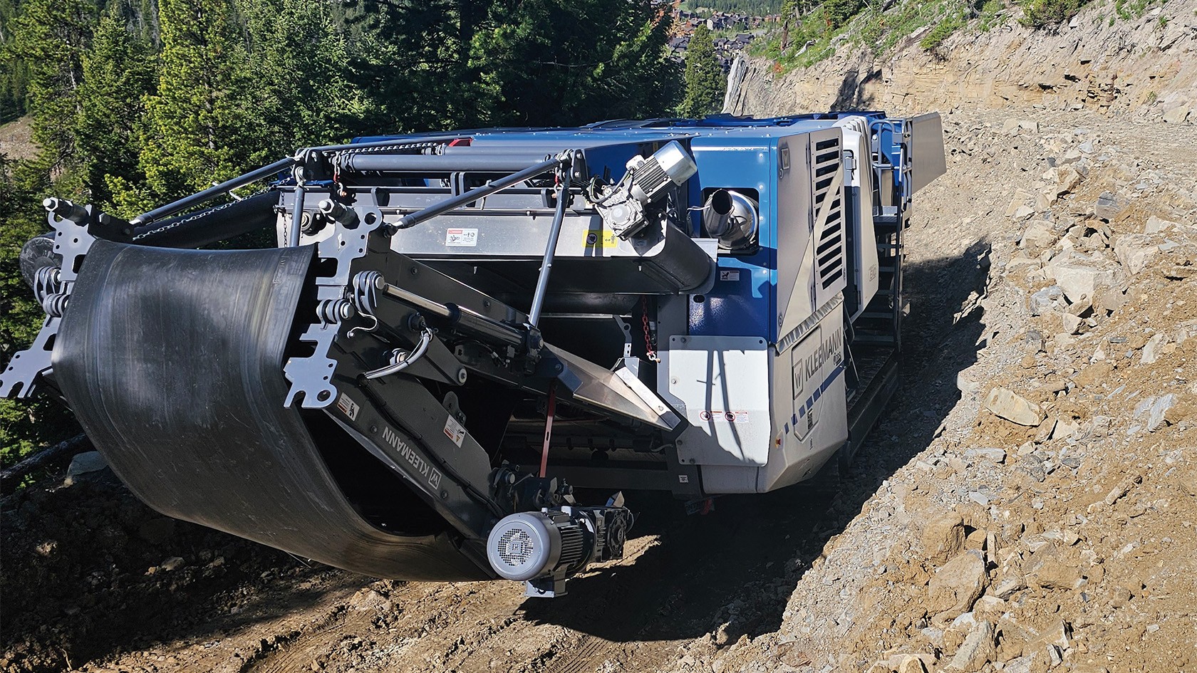 Close-up of the jaw crusher with a view on the conveyor belt of the material discharge.