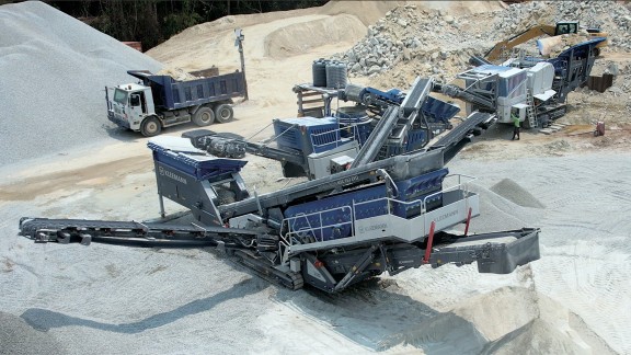 A setup plant train operating in the quarry. The main focus is on the classifying screening plant.