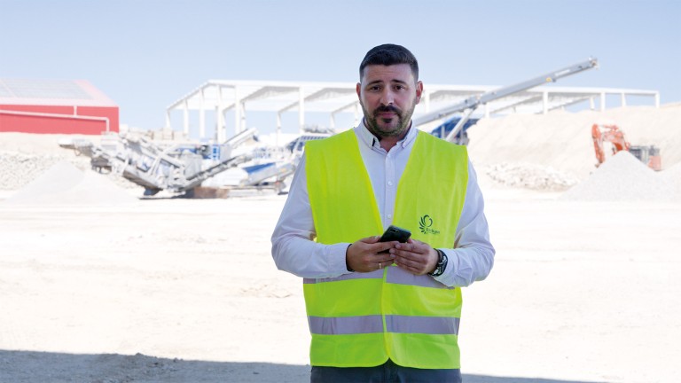 Man standing in front of his Kleemann plants looking confidently into the camera.