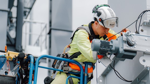 Apprentice engaged in installation work on the CORE.