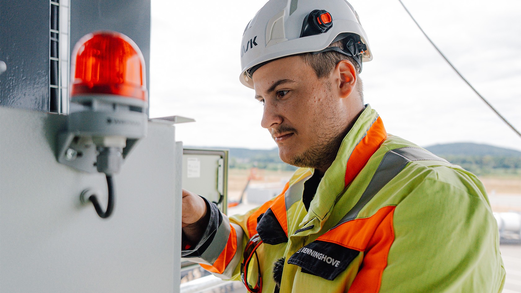 A trainee hard at work on the CORE, with a signal lamp seen in the foreground.
