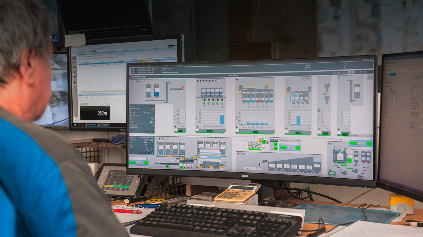 Look over the mixing foreman’s shoulder at a computer screen showing diagrams of the control system.